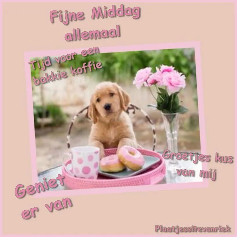 Een schattige puppy zit aan een tafel met donuts en bloemen.