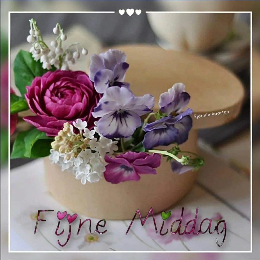 Een doosje met kleurrijke bloemen en de tekst "Fijne Middag".