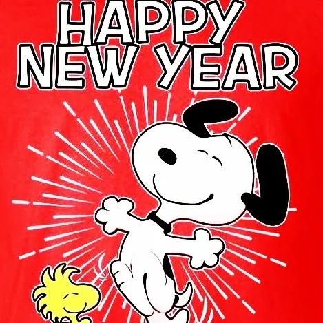 Snoopy danst enthousiast met een feestelijke tekst "Gelukkig Nieuwjaar".
