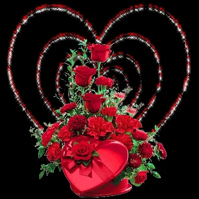 Een boeket met rode rozen en anjers in een hartvormige doos.