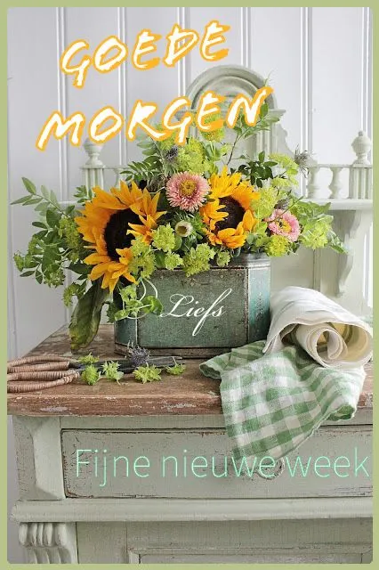 Bloemenarrangement met zonnebloemen en tekst: "Goedemorgen, fijne nieuwe week".