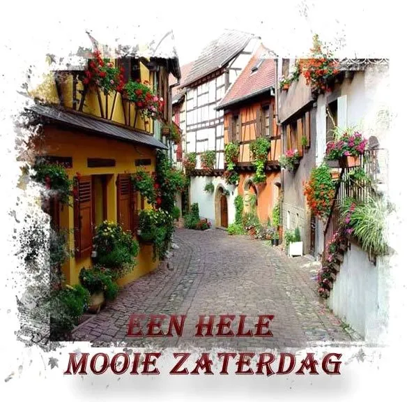 ᐅ mooie zaterdag - Zaterdag plaatjes Smal straat met kleurrijke huizen en bloeiende planten. Gezellige sfeer.
